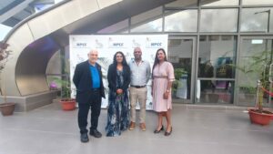 the honoris team standing in front of the npcc's backdrop