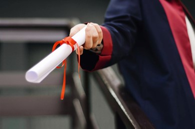 study business - graduate holding a certificate