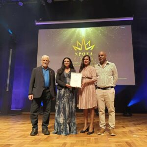The honoris team holding the silver award from NPCC
