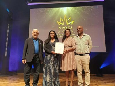 The honoris team holding the silver award from NPCC