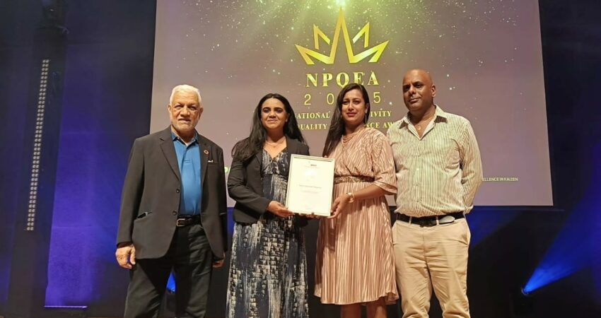 The honoris team holding the silver award from NPCC
