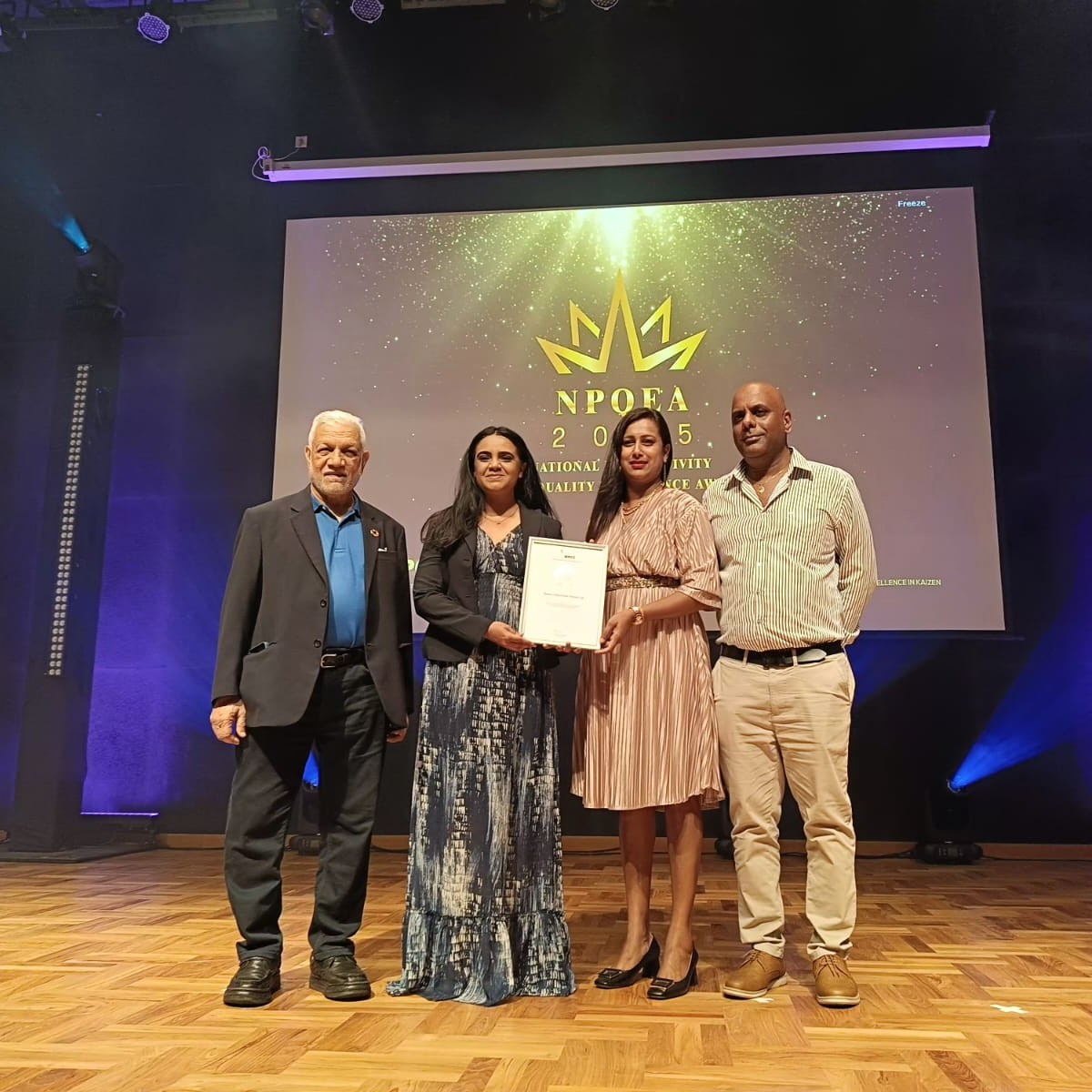 The honoris team holding the silver award from NPCC