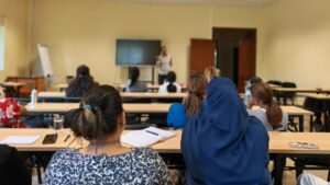 employees attending a wellness session on IWD
