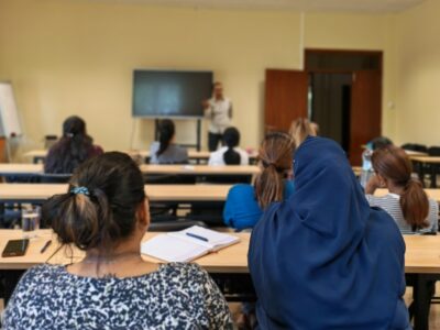 employees attending a wellness session on IWD