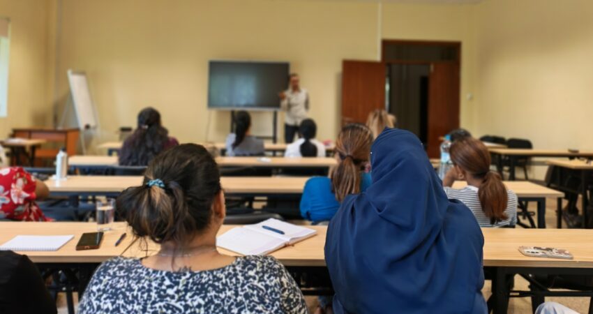 employees attending a wellness session on IWD